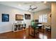 Office with cork floors, ceiling fan, a window with shutters, and plenty of desk space at 1221 E Claire Dr, Phoenix, AZ 85022