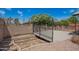 An outdoor patio area surrounded by block fencing with landscaped gravel at 1225 E Jacob Ln, Phoenix, AZ 85020