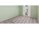 Bedroom with green walls and a bright window with sheer white curtains at 1225 E Jacob Ln, Phoenix, AZ 85020