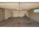 A spacious garage area with concrete floors and a convenient side door at 1225 E Jacob Ln, Phoenix, AZ 85020