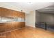 Cozy kitchen features plenty of counterspace and wood cabinetry that provides ample storage space at 1225 E Jacob Ln, Phoenix, AZ 85020