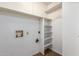 A laundry room with a built in storage cabinet and washing machine hook-ups at 1225 E Jacob Ln, Phoenix, AZ 85020