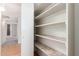 Spacious pantry with multiple shelves for optimal storage and organization at 1225 E Jacob Ln, Phoenix, AZ 85020