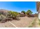 Spacious backyard featuring a blank canvas ready for new landscaping ideas and a block fence for added privacy at 12913 W Columbine Dr, El Mirage, AZ 85335
