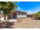 Spacious backyard with a covered patio, promising outdoor relaxation and entertainment at 12913 W Columbine Dr, El Mirage, AZ 85335