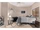 Bedroom with neutral decor, a ceiling fan, and carpet flooring for a peaceful retreat at 12913 W Columbine Dr, El Mirage, AZ 85335