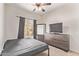 Bedroom featuring neutral walls, carpet, and a ceiling fan, offering a relaxing retreat at 12913 W Columbine Dr, El Mirage, AZ 85335