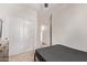 Bedroom with double closets and neutral walls, creating a simple, serene space at 12913 W Columbine Dr, El Mirage, AZ 85335