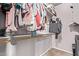 Walk-in closet with clothing racks and shelves for organized storage at 12913 W Columbine Dr, El Mirage, AZ 85335