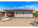 Backyard view showcases an outdoor patio area and solar panels on the roof, blending relaxation and energy efficiency at 12913 W Columbine Dr, El Mirage, AZ 85335