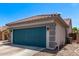 Two-car garage with a blue door and well-maintained exterior, showcasing practical storage and curb appeal at 12913 W Columbine Dr, El Mirage, AZ 85335