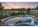 Expansive backyard featuring a custom pool with slide and spa, perfect for entertaining and enjoying the outdoors at 13365 N 74Th St, Scottsdale, AZ 85260