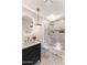 Elegant bathroom featuring a glass shower, vessel sink with modern fixtures, and a decorative mirror at 13365 N 74Th St, Scottsdale, AZ 85260