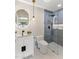 Modern bathroom featuring a glass shower, vessel sink with modern fixtures, and a decorative mirror at 13365 N 74Th St, Scottsdale, AZ 85260