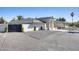 Beautifully landscaped single-story home featuring a gray tile roof, modern design, and inviting entryway at 13365 N 74Th St, Scottsdale, AZ 85260