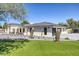 Beautiful home exterior featuring turf, desert landscaping, and sleek black trim windows at 13365 N 74Th St, Scottsdale, AZ 85260