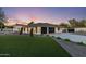 Well maintained home featuring an attached garage, manicured lawn and desert landscaping at 13365 N 74Th St, Scottsdale, AZ 85260