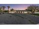 Stunning home featuring desert landscaping, a circular driveway and a white exterior and black trim at 13365 N 74Th St, Scottsdale, AZ 85260