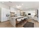 Bright kitchen features an island with marble countertop, seating, and pendant lights at 13365 N 74Th St, Scottsdale, AZ 85260