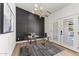Bright office with a dark accent wall, modern lighting, and tiled floors at 13365 N 74Th St, Scottsdale, AZ 85260