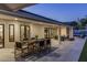 Inviting outdoor dining and seating areas, seamlessly integrated with the lush backyard and pool at 13365 N 74Th St, Scottsdale, AZ 85260