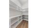 Spacious pantry with ample shelving and counter space, complete with modern wood-look flooring at 13365 N 74Th St, Scottsdale, AZ 85260