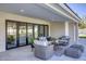 Charming covered patio with comfortable seating, offering seamless indoor-outdoor living and entertaining spaces at 13365 N 74Th St, Scottsdale, AZ 85260