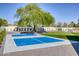Well-maintained sport court perfect for recreational activities, complemented by lush artificial turf at 13365 N 74Th St, Scottsdale, AZ 85260