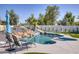 Inviting swimming pool featuring a rock water slide, spa, and comfortable seating for ultimate relaxation at 13365 N 74Th St, Scottsdale, AZ 85260