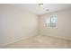 This bedroom has neutral carpet and paint with a window view to the outside at 14237 W Aster Dr, Surprise, AZ 85379