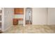 Dining area with tile floor, granite desk, and neutral walls adjacent to hallway at 14237 W Aster Dr, Surprise, AZ 85379
