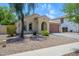 Quaint single-level house with low maintenance desert landscaping and a clean, attractive facade at 14237 W Aster Dr, Surprise, AZ 85379