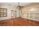 Living room showcases wooden floors, custom built-ins, and ample natural light at 14237 W Aster Dr, Surprise, AZ 85379