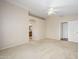 A carpeted main bedroom provides ample space and connects to an ensuite bathroom at 14237 W Aster Dr, Surprise, AZ 85379