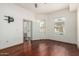 This bedroom boasts hardwood floors, large windows, and easy access to a balcony at 14575 W Mountain View Blvd # 12107, Surprise, AZ 85374