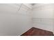 Walk-in closet is equipped with metal shelving on all sides at 14575 W Mountain View Blvd # 12107, Surprise, AZ 85374