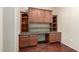 This office space has built-in wood cabinets and a large desk area at 14575 W Mountain View Blvd # 12107, Surprise, AZ 85374