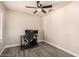 Neutral bedroom space is equipped with desk and chair, ceiling fan, and lots of light at 14624 N 90Th Ln, Peoria, AZ 85381