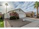 Beautiful single-Gathering home with a well maintained desert landscape, creating a welcoming and peaceful atmosphere at 14624 N 90Th Ln, Peoria, AZ 85381