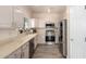 Well-equipped kitchen featuring stainless steel appliances, ample counter space and modern finishes at 14624 N 90Th Ln, Peoria, AZ 85381