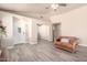 Open living area with modern flooring, white door and spacious layout at 14624 N 90Th Ln, Peoria, AZ 85381