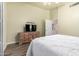 Spacious main bedroom includes a dresser, television, and neutral paint, creating a calming atmosphere at 14624 N 90Th Ln, Peoria, AZ 85381