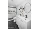 Modern bathroom featuring double sinks, matte black fixtures, and a stylish tiled shower with glass door at 14635 N 37Th Pl, Phoenix, AZ 85032