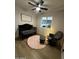 Comfortable Bedroom featuring a crib, rocking chair, and plush rug, creating a soothing environment at 14635 N 37Th Pl, Phoenix, AZ 85032