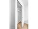 Bright closet featuring sliding doors and a sleek, built-in shelf offering ample storage space at 14635 N 37Th Pl, Phoenix, AZ 85032