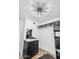 Bright closet with built-in storage, shelving, drawers, and a decorative leaf-style light at 14635 N 37Th Pl, Phoenix, AZ 85032