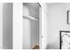 Empty closet with sliding door and a metal bar for hanging clothes at 14635 N 37Th Pl, Phoenix, AZ 85032