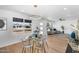 Open-concept dining area flows into living room with a view of the neighborhood at 14635 N 37Th Pl, Phoenix, AZ 85032