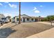 Single-story house with low-maintenance landscaping, long driveway to garage and nearby vehicle, offering practicality at 14635 N 37Th Pl, Phoenix, AZ 85032