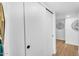Hallway features a modern sliding door, creating a sleek and minimalist aesthetic at 14635 N 37Th Pl, Phoenix, AZ 85032